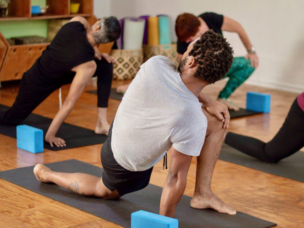 Students practice yoga during a class at The Toolbox, a studio in Durban. PHOTO COURTESY OF NOSIZWE MJI. 