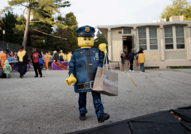 Gompers student dressed as a Lego man trunk-or-treating.
PHOTO: JULIA HOLZ ’23/THE HAWK