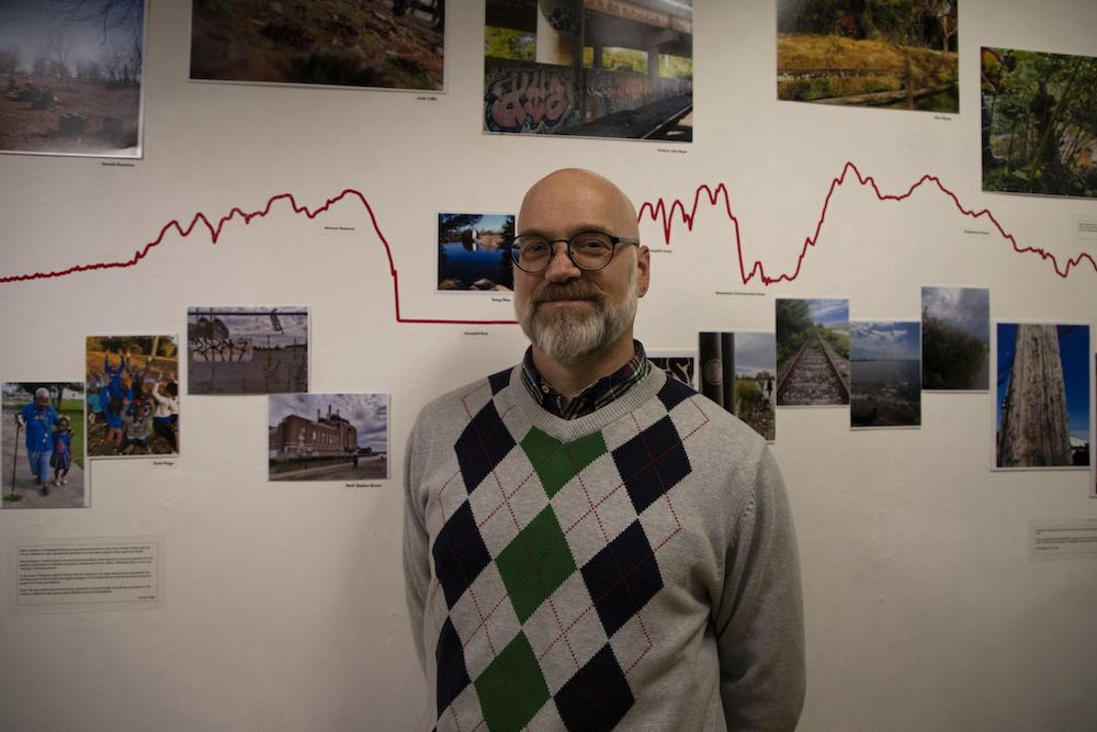 Mark Brown with the two photos he submitted to “Walking the Edge.”
PHOTO: KELLY SHANNON ’24/THE HAWK