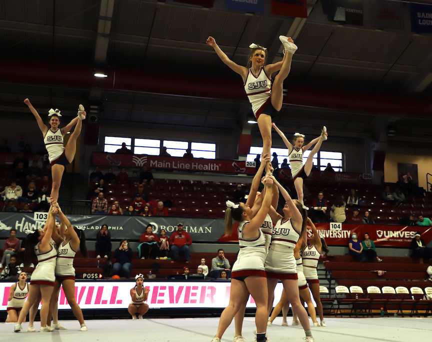 The cheer team performs at the womens basketball game on Feb. 20. PHOTO: KELLY SHANNON 24/THE HAWK