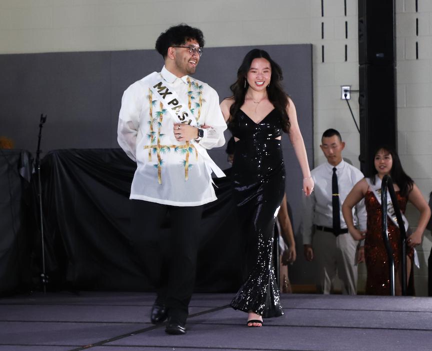 Paolo Bayotas III, the pageant winner, escorted by fellow Stockton University student Emily Luc.