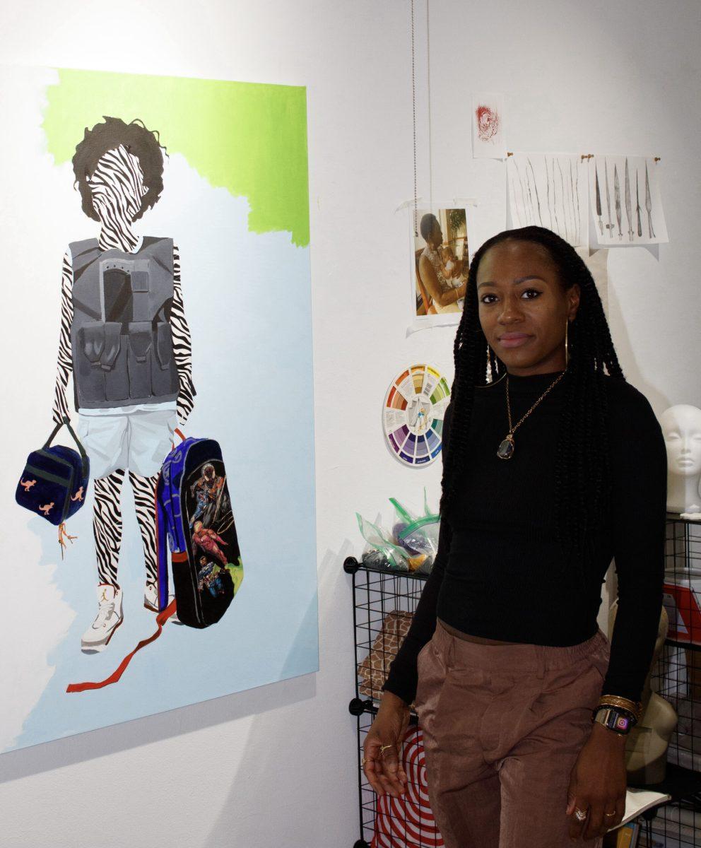 Jazlyne Sabree with her painting “Ready for School” in her PAFA art
studio. PHOTO: HANNAH MADEYA ’24/THE HAWK