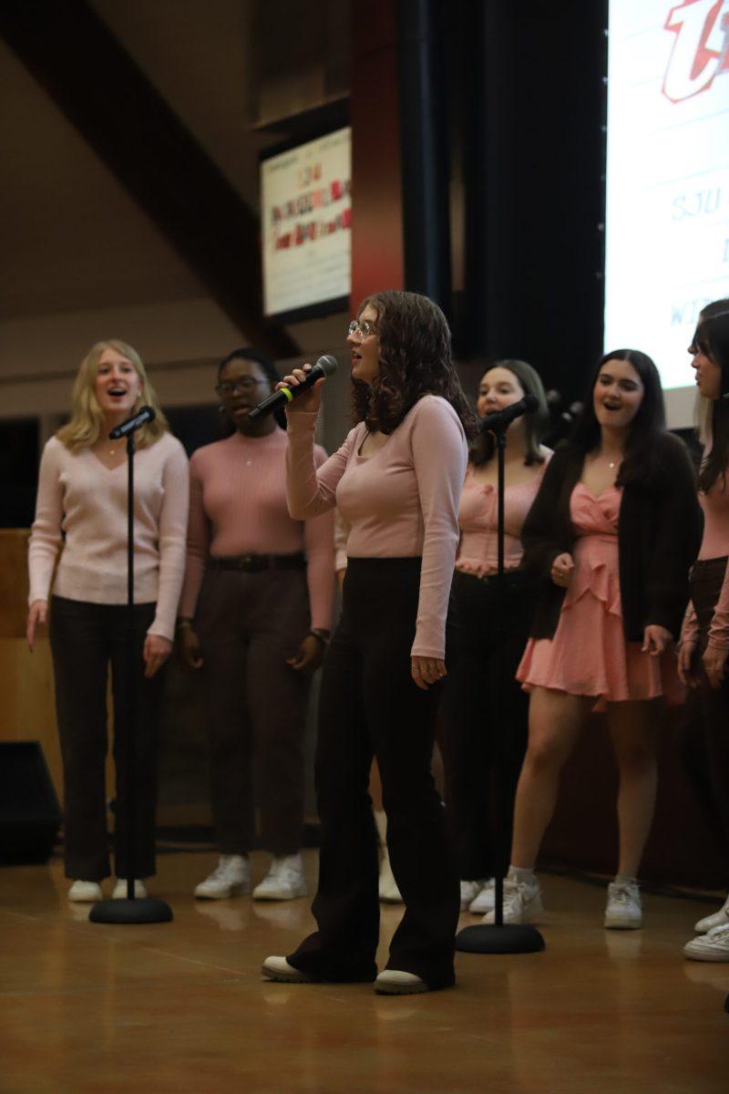 Maeve DeNardo ‘23 sings in the St. Joe’s a cappella Invitational at   Cardinal Foley Campus Center March 3. A cappella groups from five Philadelphia area universities participated.  PHOTO: THE HAWK