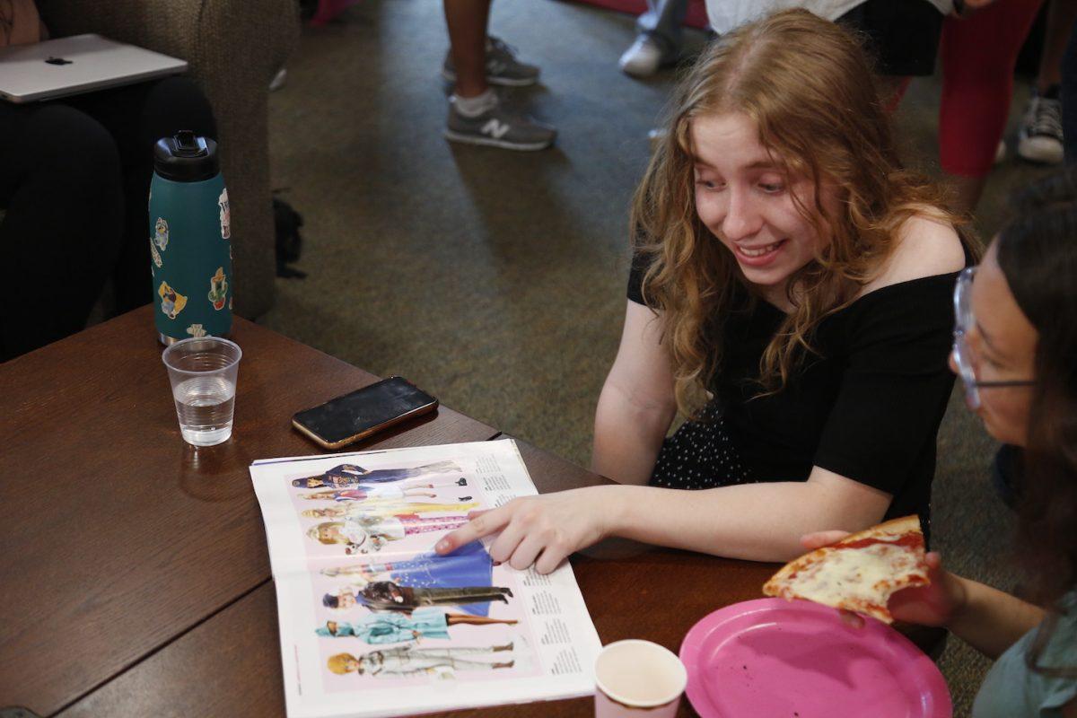 Alicia Jones ’26 looks at Time Magazine’s Barbie issue Oct. 4 during A Year of Barbie event.
PHOTO: MADELINE WILLIAMS ’26/THE HAWK