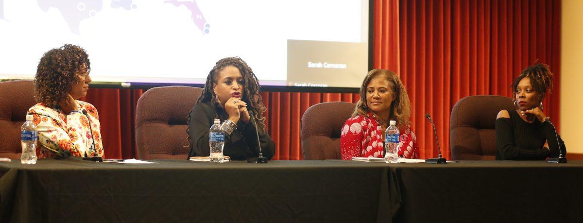 Moderator Carrie Nelson-Robinson and panelists D. Wendy Greene, J.D., LLM; Kimya S.P. Johnson, J.D.; and Jennifer Benn speak at an Oct. 5 panel on the
CROWN Act in Mandeville Hall Teletorium. PHOTO: MADELINE WILLIAMS ’26/THE HAWK