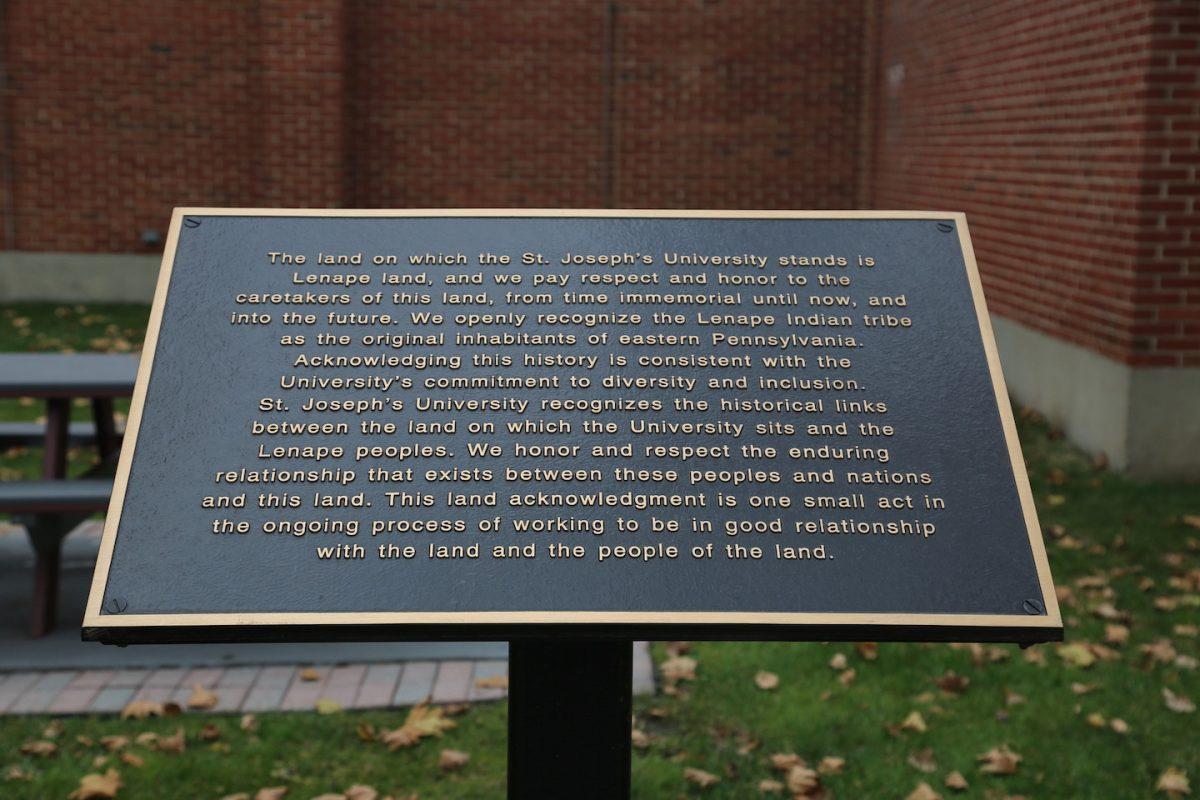 St. Joe's land acknowledgment plaque near Alumni Hall on the UCity campus, Nov. 27.
PHOTO: MADELINE WILLIAMS ’26/THE HAWK