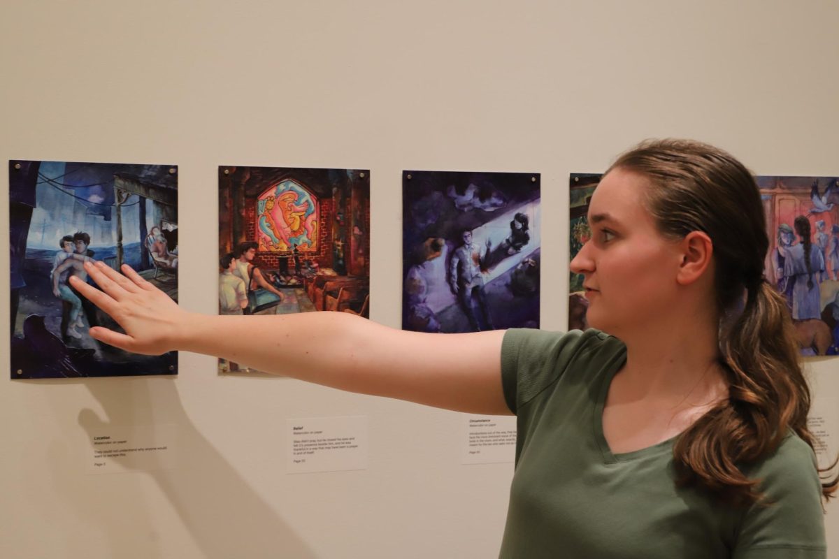 Anne Gutherman ’24 showcases her artwork in the Frances M. Maguire Art Museum. PHOTO: LUKE SANELLI 26/THE HAWK