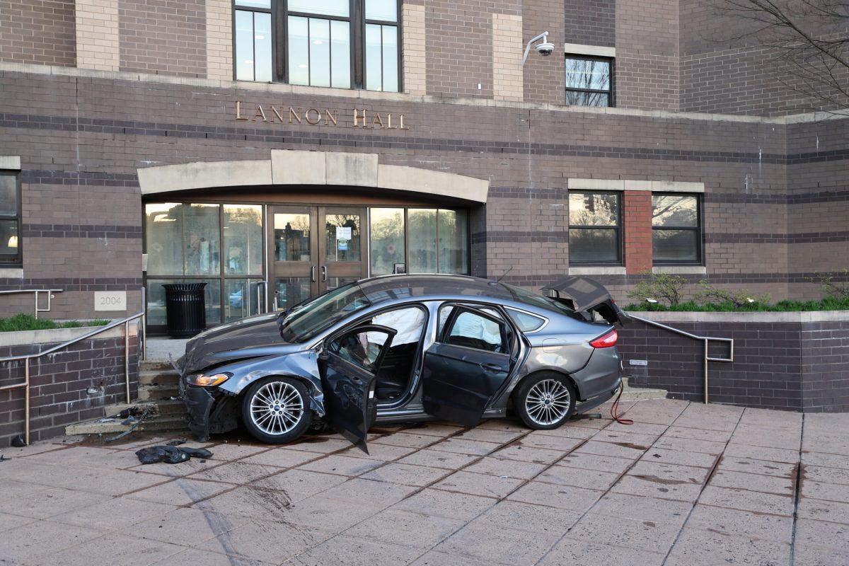 A car crashed on the stairs of Lannon Halls front entrance April 16 at 6:45 p.m. PHOTO: MAX KELLY ’24/THE HAWK