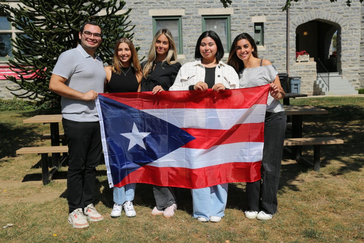 The Puerto Rican Student Association creative board poses on Hawk Hill campus, Sept. 9. 
PHOTO: MADELINE WILLIAMS ’26/THE HAWK