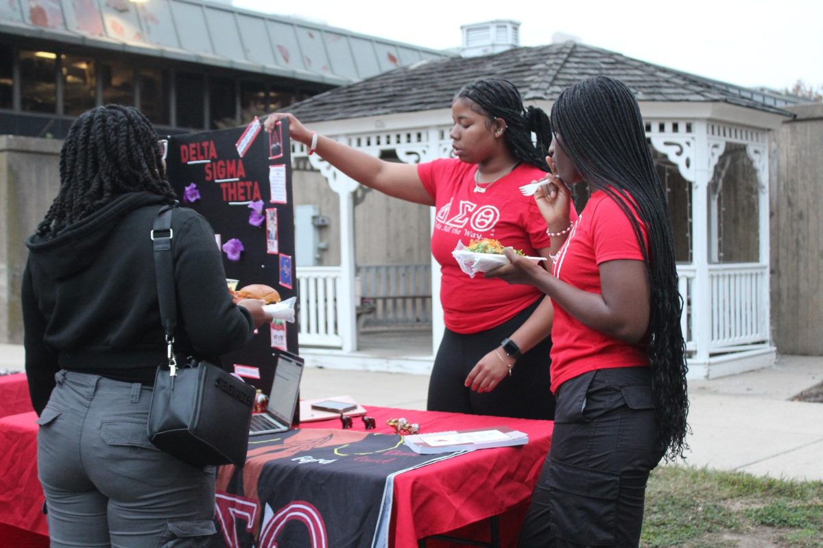 Taylor Ball ’25 and La Salle University student Mariatu Kebbay provide information
about their sorority, Delta Sigma Theta, to La Salle University student Naomi Michel at
the Black Student Union’s Meet the Greeks event Oct. 4.
PHOTO AND REPORTING: ZACH PODOLNICK ’26/THE HAWK