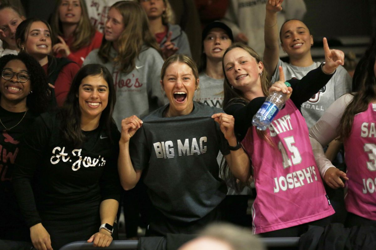 Fans cheer for St. Joe’s women’s basketball team during the 2024 Women's Basketball Invitational Tournament
quarterfinal game against Villanova, March 28. PHOTO: MADELINE WILLIAMS ’26/THE HAWK