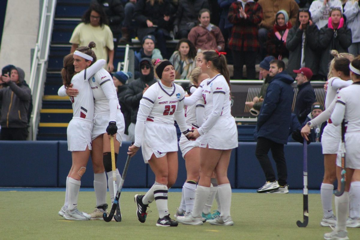 St. Joe’s field hockey console each other following a 5-0 loss to Northwestern in the national championship, Nov. 24. PHOTO: MIA MESSINA '25/THE HAWK.