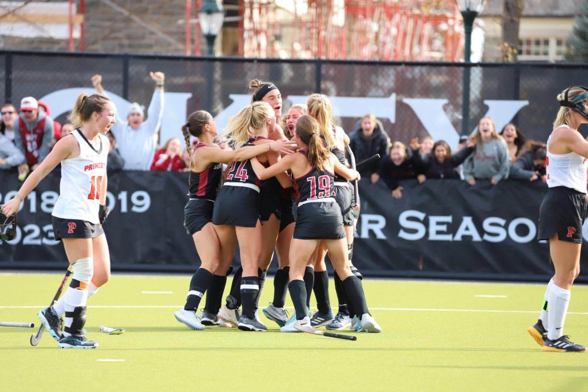 St. Joe’s field hockey celebrates fifth-year midfielder Celeste Smits’ late goal against Princeton to give the Hawks the lead, Nov. 19. PHOTO: MIA MESSINA ’25/THE HAWK