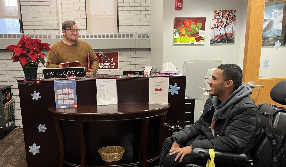 Seamus McBride ’26, who works at the front desk in the Success Center, and also uses the academic coaches at the Success Center as a resource talks with Anthony Barnes ’27 who said using the resources at the Success Center improved his study habits. PHOTO TRICIA NICOLETTI '27.