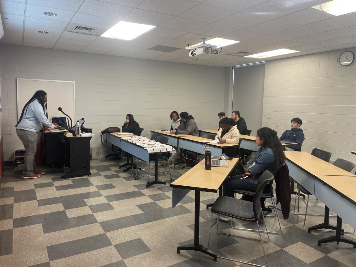 Brian Yates, Ph.D., professor of history and director of the American Studies Program, teaches his First Year Seminar, Race and Sport in America, Feb. 24. PHOTO: HANNAH PAJTIS ’26/THE HAWK