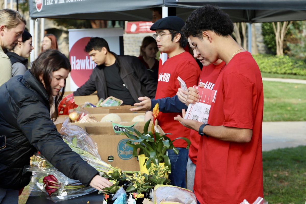 Students pick out produce at a free Trader Joe’s pop-up sponsored by HawkHUB,
Nov. 11, 2023. PHOTO: ALLIE MILLER ’24/THE HAWK