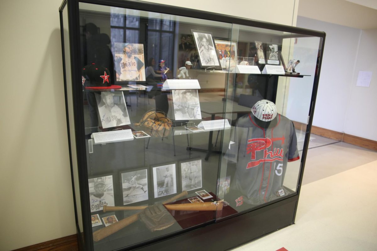 A display case showcasing memorabilia from the Negro Leagues as part of the new “A League Apart” exhibit in Mandeville Hall.