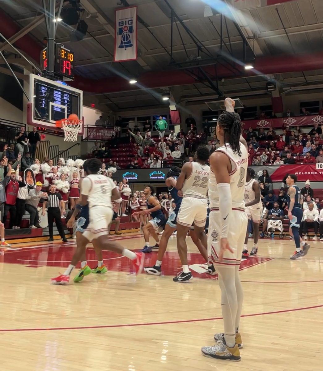 Senior Erik Reynolds II sinks a 3-pointer with 3:14 left in the first half to surpass the 21-year-old program scoring record set by Jameer Nelson ’18, in the The Hawks' match up against Rhode Island, March 5 in Hagan Arena. PHOTO: MIA MESSINA ’25/THE HAWK