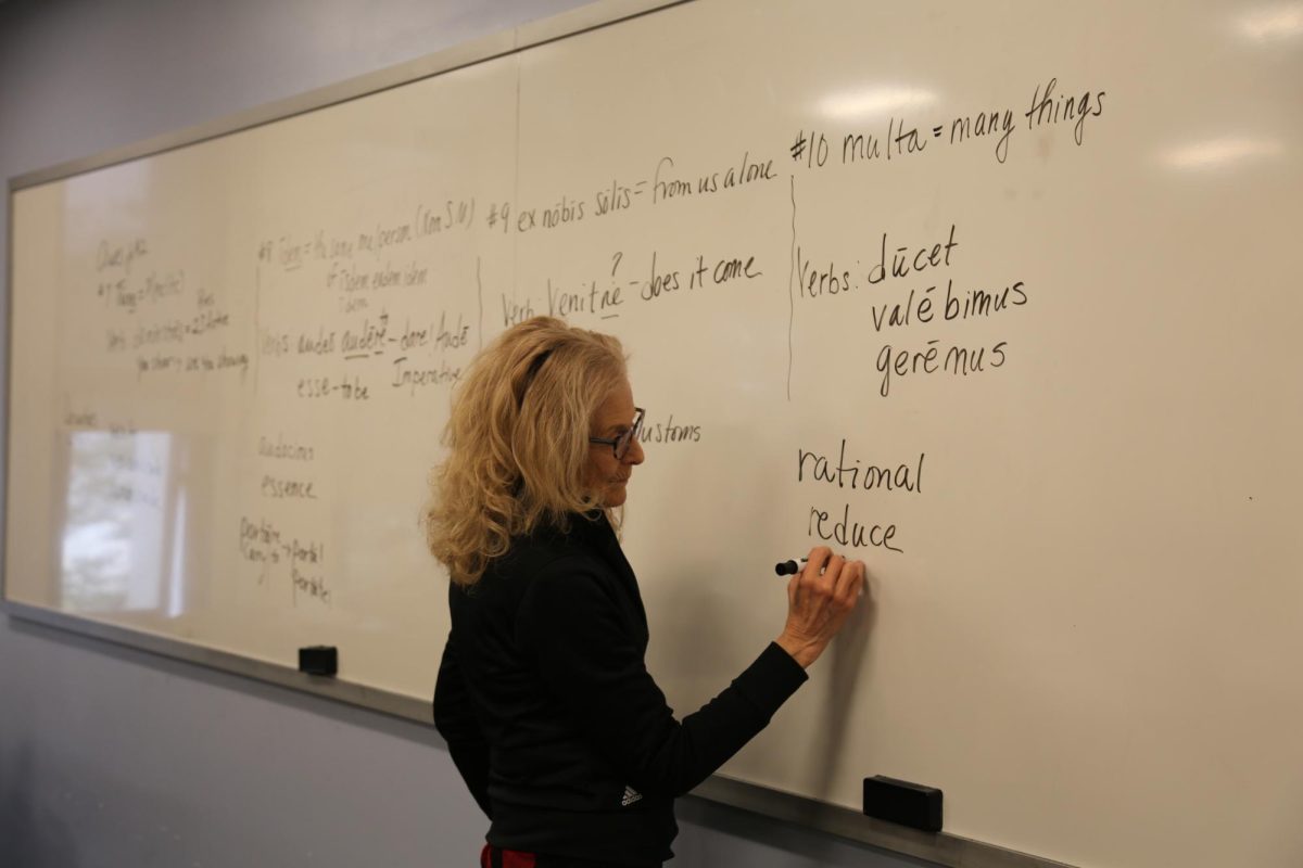 Mary Brown, adjunct professor of Latin, teaches to her Beginning Latin II class, Feb. 19. PHOTO: MADELINE WILLIAMS ’26/THE HAWK