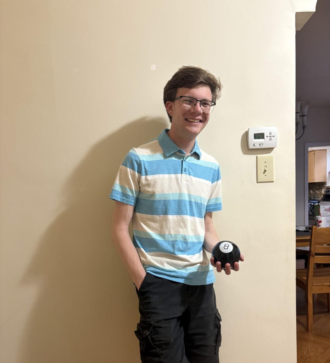 Eddie Dolan ’25 let his Magic 8 Ball, whom he named "Meb," make his decisions for the day. PHOTO: THE HAWK