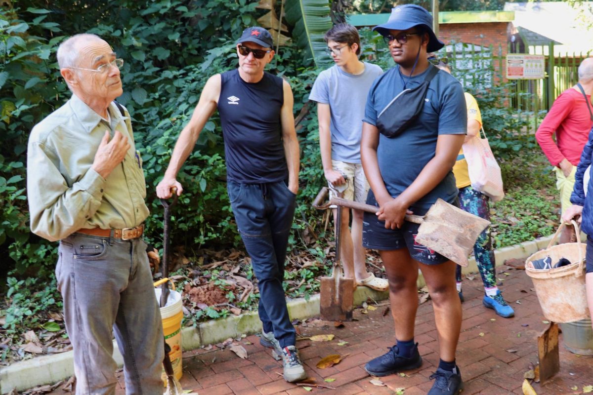 Crispin Hemson (left), organizer of the Pigeon Valley Nature Reserve’s June 21 cleanup event, instructs a group of volunteers on the afternoon’s tasks. PHOTO: CARA SANTILLI/THE HAWK
