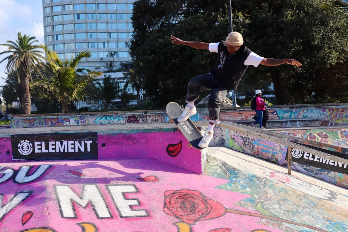 Melusi Mashawana, co-owner of the skate brand Hidden Junk and a cashier at Durban Skate Park, performs a skate trick called grinding. Photo: FINNEGAN CROWLEY/THE HAWK