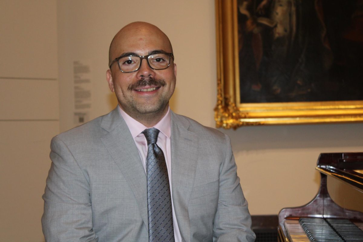 Internationally renowned pianist Christopher Guzman, DMA, takes a seat after concluding his final piece, Sept. 26.