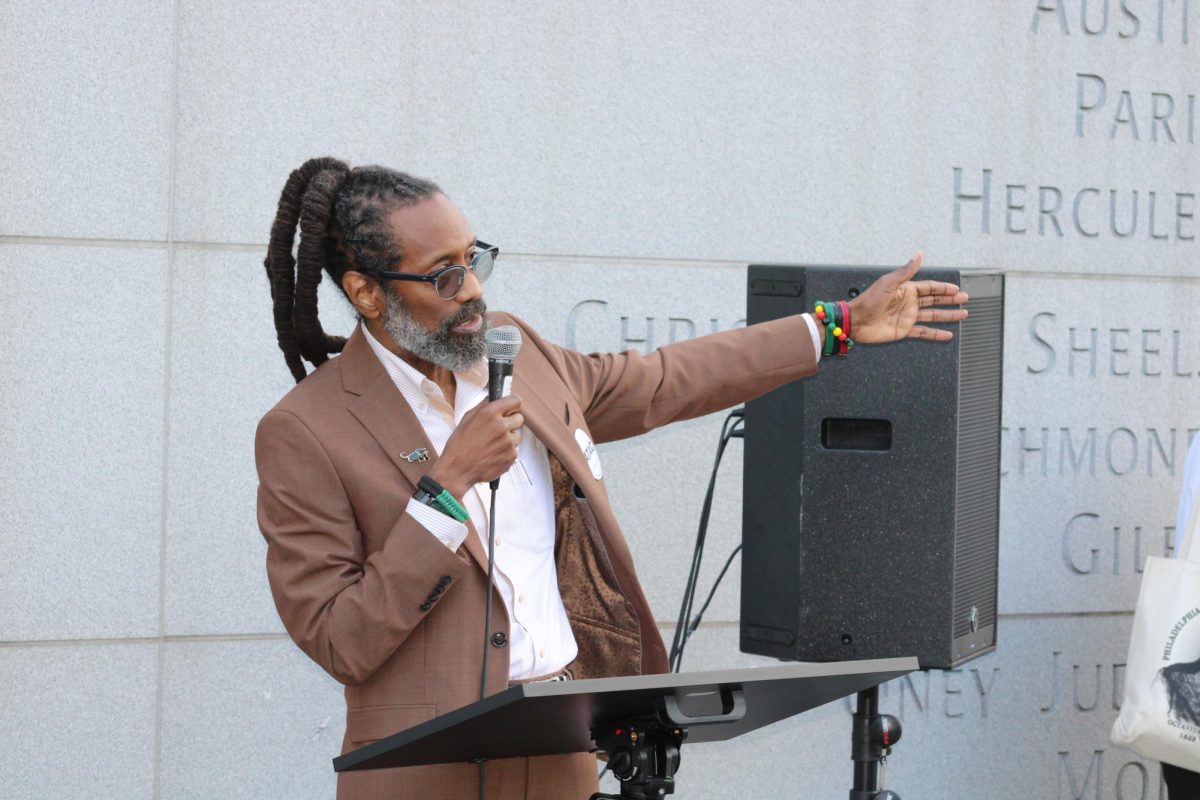Michael Coard speaks at an Avenge The Ancestors Coalition rally at the President’s House, Sept. 13. PHOTO: LUKE SANELLI ’26/THE HAWK