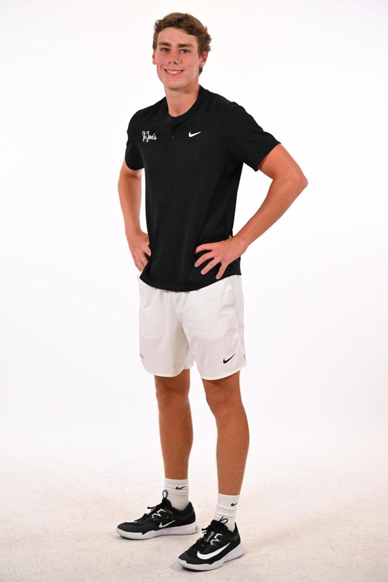 First-year Davi Carlos starts on the men’s tennis team after training under head coach Jeffrey Puhan. PHOTO COURTESY OF SJU ATHLETICS