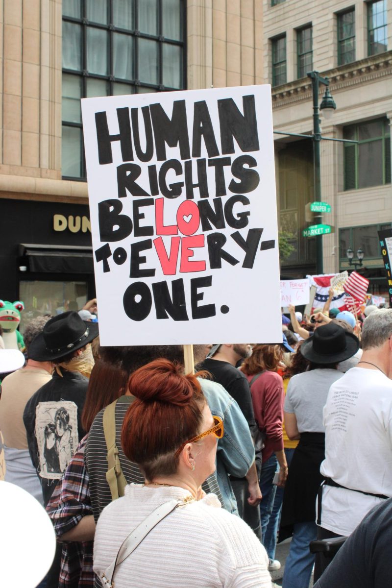 A demonstrator holds up a sign at the Philadelphia “No Kings” rally, Oct. 18. PHOTO: LUKE SANELLI ’26/THE HAWK