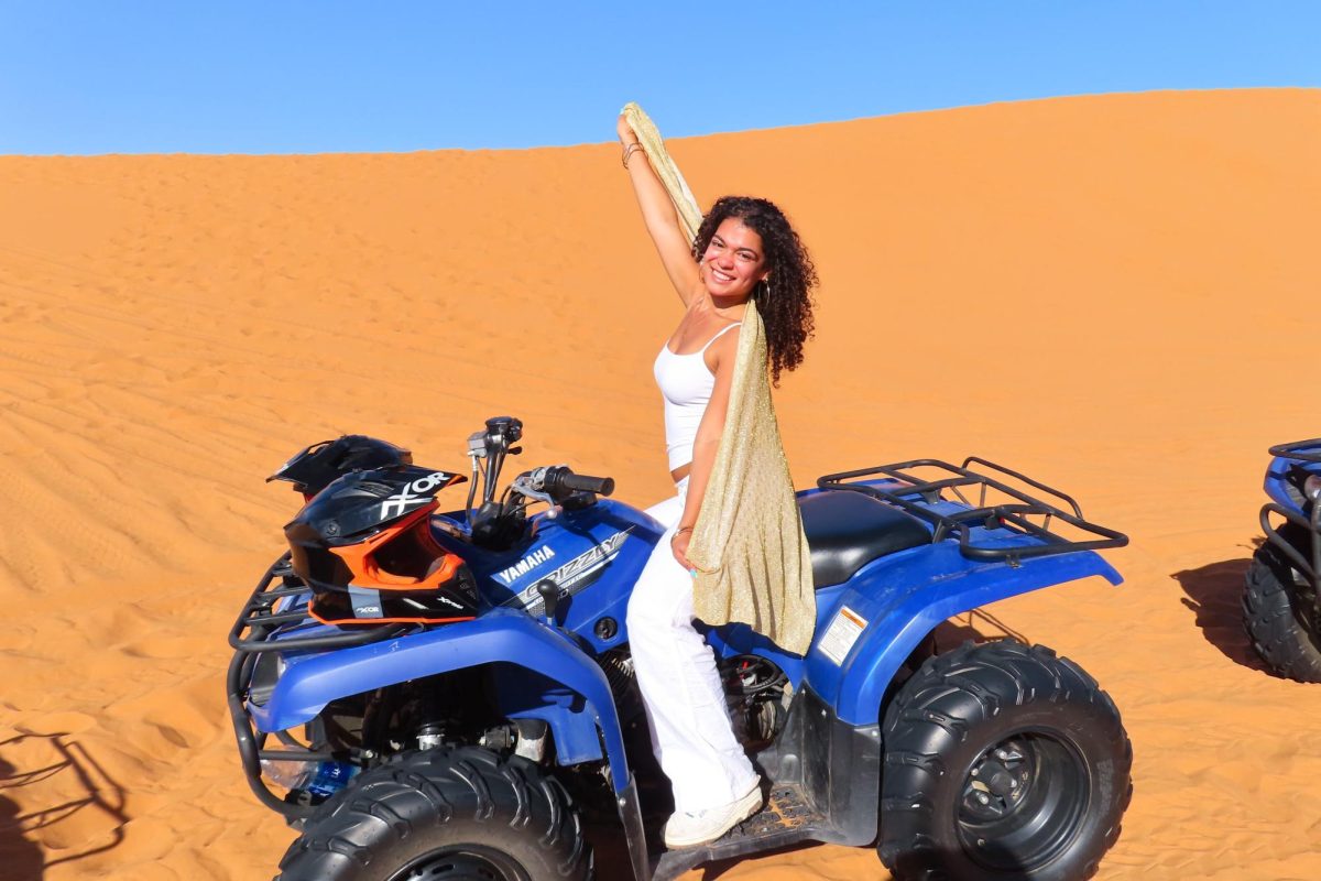 Lisbeth Urena ’27 poses on an all-terrain vehicle in Morocco.