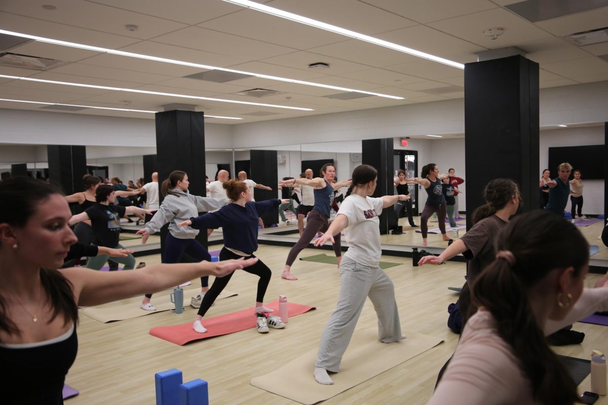 Students particpating in Steph McCaffrey’s ’04 Monday night gentle yoga class.
PHOTO: ZACH PODOLNICK ’26/THE HAWK