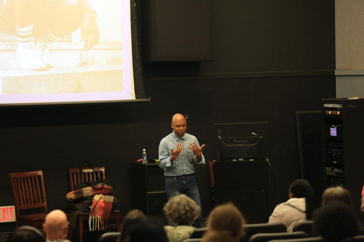Tre Johnson speaks to a room of students about his book “Black Genius.” PHOTO: ZACH PODOLNICK ’26/THE HAWK