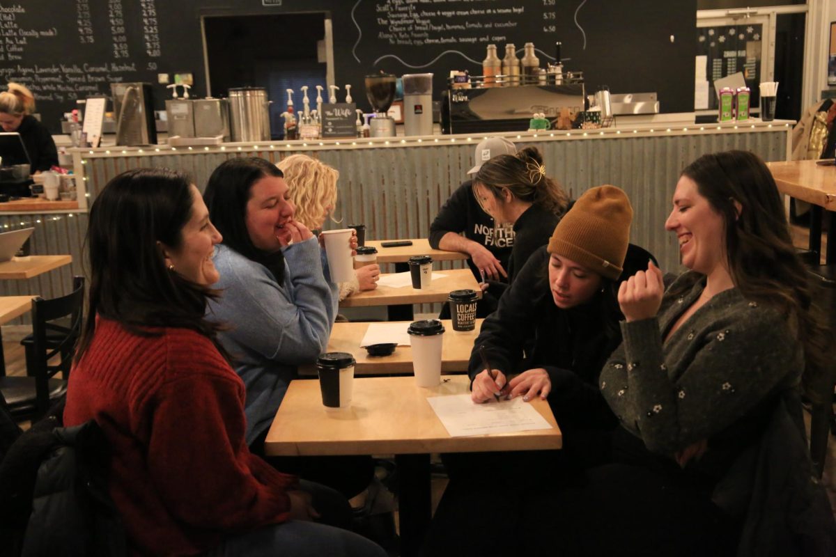 Participants drink coffee from Locals Coffee – Roastery & Café and work in small teams to answer trivia questions Jan. 23. PHOTOS: ZACH PODOLNICK ’26/THE HAWK