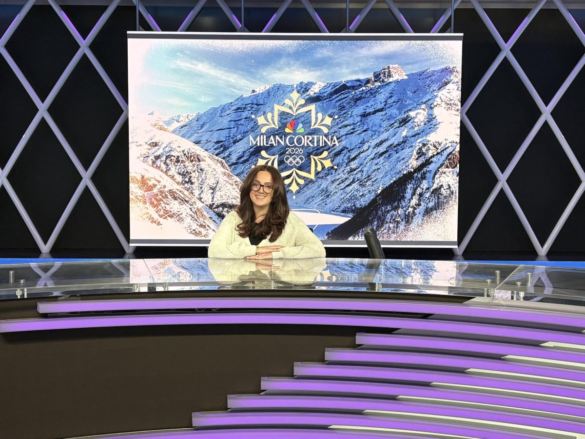Mia Messina ’25 sits at the NBC Sports Center desk in Stanford, Connecticut, where she will cover the Milano
Cortina Olympic Games. PHOTO COURTESY OF MIA MESSINA ’25