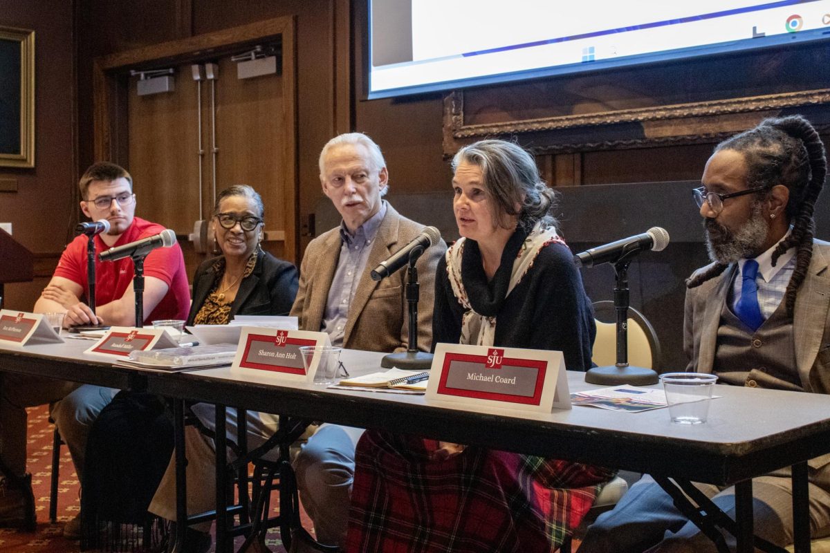The Hawk’s digital content editor, Luke Sanelli ’26, posed questions to panelists (from left to right) Roz McPherson, Randall Miller, Sharon Ann Holt, and Michael Coard. About 50 people attended a panel discussion held in response to the removal of an outdoor exhibit “The President's House: Freedom and Slavery in the Making of a New Nation” located at the site where The Capitol of the U.S. once stood. The exhibit was removed as the result of an executive order from the White House. PHOTO: FELICIA CARROL '27