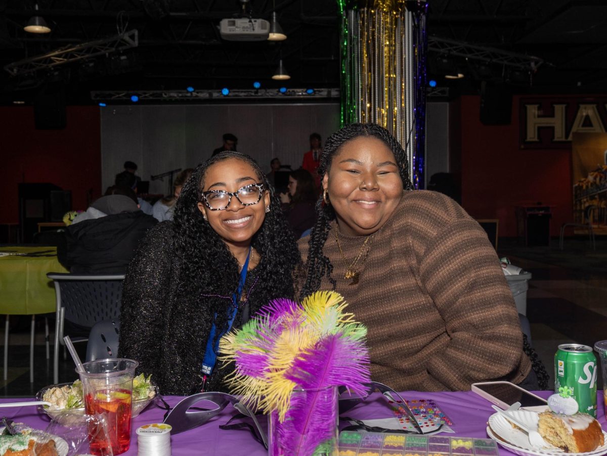Students take a break from mask-making at a Mardi Gras Celebration hosted by Hawk Hill Productions in The Perch, Feb. 18. Attendees were treated to News Orleans-style snacks, beverages, and a live Jazz Band. PHOTOS: JOSHUA ARROYO ’29