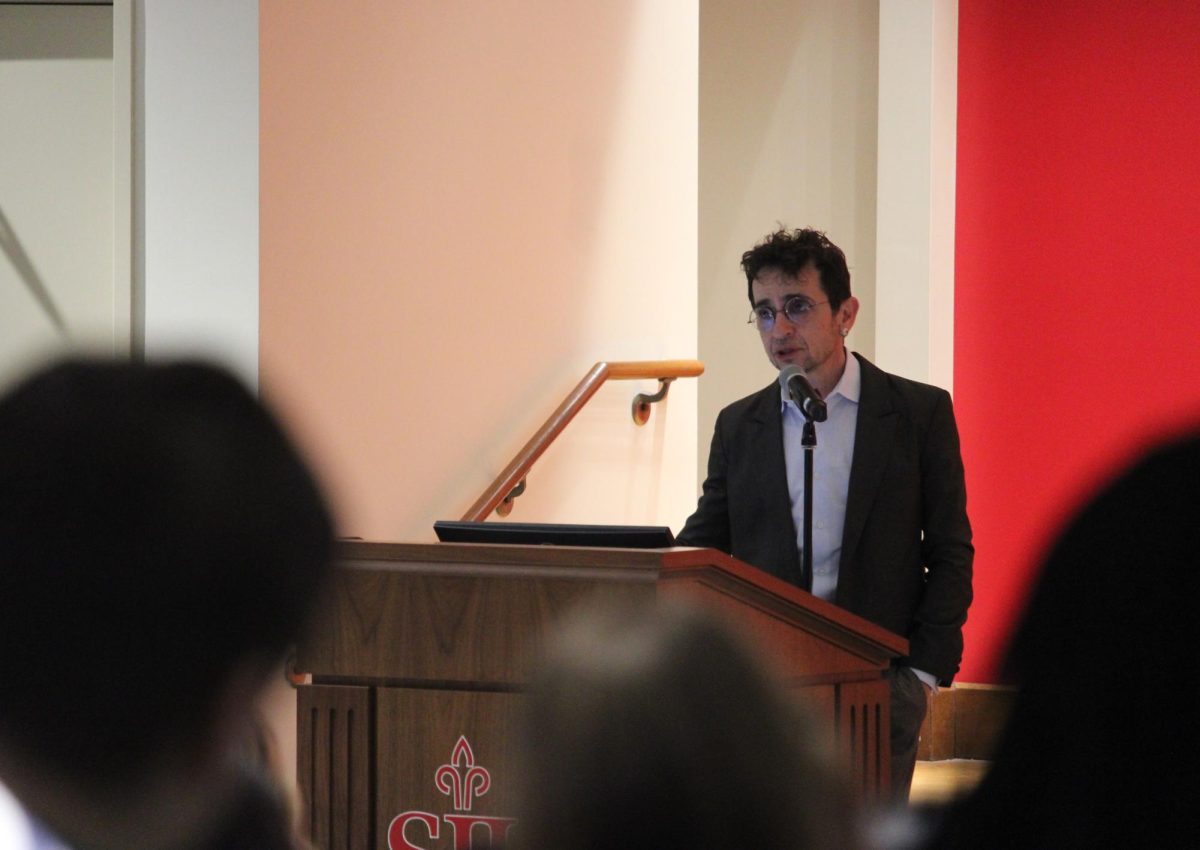 M. Gessen delivers their lecture in the Mandeville Teletorium, March 19.