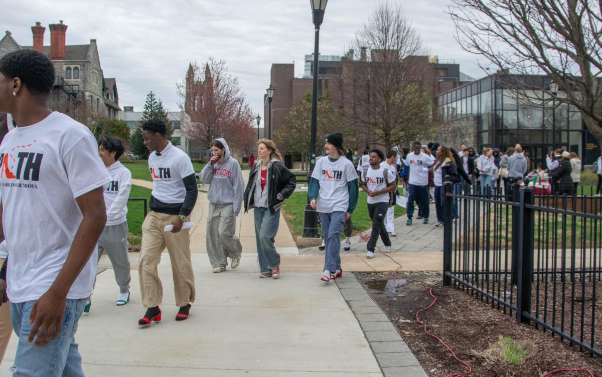 Participants walk a mile in heels to show solidarity with survivors of sexual violence March 27. PHOTOS: PRESTON THOMAS ’28/THE HAWK