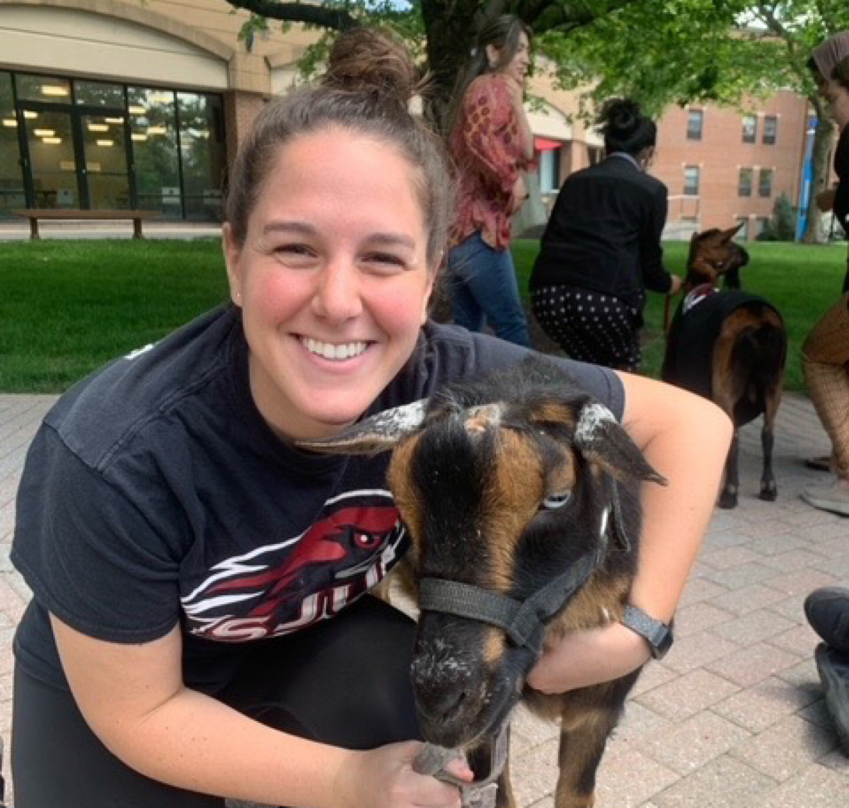 Assistant athletic director for campus recreation, Alexandra Kissinger, poses with a goat at a therapy event.
PHOTO COURTESY OF ALEXANDRA KISSINGER